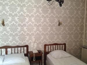 Postel nebo postele na pokoji v ubytování Hotel Du Nord