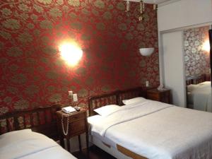 Postel nebo postele na pokoji v ubytování Hotel Du Nord