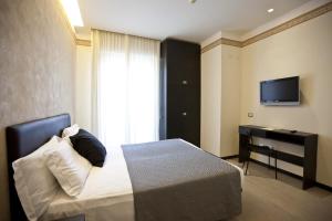 TV a/nebo společenská místnost v ubytování Hotel Aurora