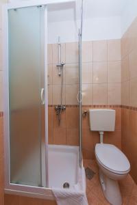 a bathroom with a shower with a toilet and a sink at Studio Brela 2752d in Brela