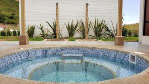 a swimming pool in the middle of a yard at Finca Masada in Mira