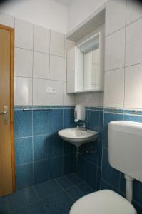 a bathroom with a toilet and a sink at Studio Milna 3074c in Hvar