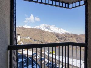 a view of a snow covered mountain from a balcony at Appartement Saint-Lary-Soulan, 2 pièces, 6 personnes - FR-1-296-430 in Saint-Lary-Soulan