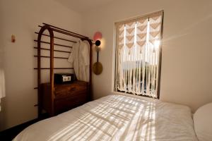 Katil atau katil-katil dalam bilik di Quang Vinh Apartment and Hotel Hoi An