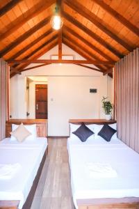 Postel nebo postele na pokoji v ubytování Misty Villas + 37 fotografií
