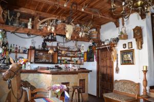 a bar with a fireplace in a room at Gościniec Podkowa in Włodawa