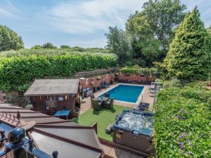 an aerial view of a backyard with a swimming pool at Freshwinds in Market Drayton