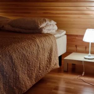 Postel nebo postele na pokoji v ubytování Revontulen Tupa