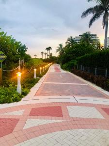 a walkway with lights on the side of a road at Condo 103 in Miami Beach