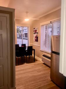 a kitchen and dining room with a table and a refrigerator at Condo 103 in Miami Beach +22 photos