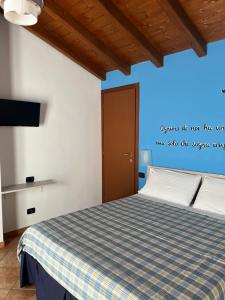 A bed or beds in a room at Color House Malpensa B&B