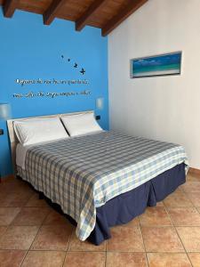 A bed or beds in a room at Color House Malpensa B&B