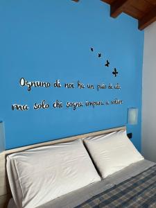 A bed or beds in a room at Color House Malpensa B&B