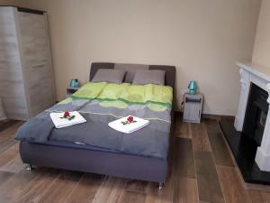 Posteľ alebo postele v izbe v ubytovaní Szilvaliget Vendégház