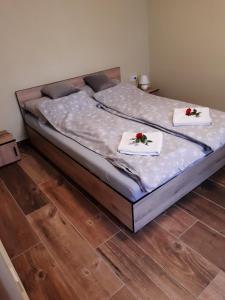 Postel nebo postele na pokoji v ubytování Szilvaliget Vendégház