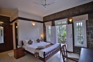 Voodi või voodid majutusasutuse Chithirapuram Palace toas