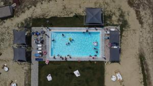 The swimming pool at or close to RESORT REIS country house Még 32 kép