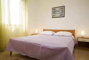 Postel nebo postele na pokoji v ubytování Apartments Valentina-B