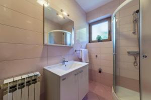 a bathroom with a sink and a shower at Apartments with parking space Rabac, Labin - 3011 in Rabac +35 photos