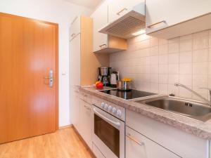 a kitchen with a sink and a counter top at Apartment in Neustift near Ski Lift in Neustift im Stubaital