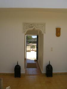 an entrance to a room with an open door at RIAD ACACIA in Essaouira