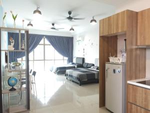 a room with a kitchen and a living room at Palazio AegeanSea Homestay By Easyhomestay in Johor Bahru +64 photos