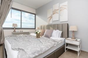 Ein Bett oder Betten in einem Zimmer der Unterkunft Unixx Pattaya by Alvin