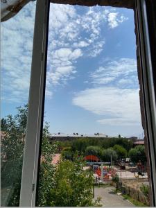 a window view of a blue sky with clouds at Doctor's House in Gyumri