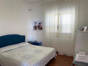 Posteľ alebo postele v izbe v ubytovaní Villa Anna - Appartamento relax 3 minuti a piedi dalla spiaggia
