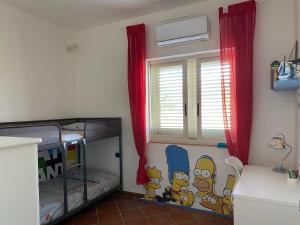 Televízia a/alebo spoločenská miestnosť v ubytovaní Villa Anna - Appartamento relax 3 minuti a piedi dalla spiaggia