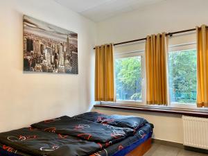 Posteľ alebo postele v izbe v ubytovaní Aparthotel Superjednostka Katowice