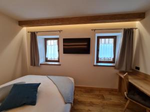 Posteľ alebo postele v izbe v ubytovaní La Culla B&B