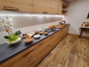 a buffet line with many different types of food on it at La Culla B&B in Padola