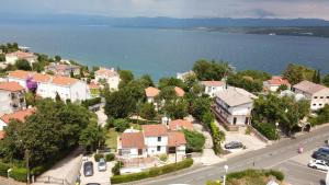 an aerial view of a town next to the water at Apartmani Natasa in Vantačići