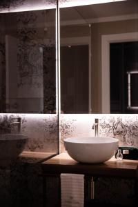 a bathroom with a white sink and a mirror at Agriturismo Maria Vittoria in Custoza