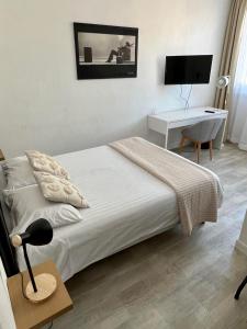 Postel nebo postele na pokoji v ubytování Hotel Joly