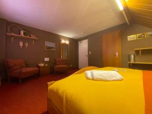 Posteľ alebo postele v izbe v ubytovaní Honolulu Hotel