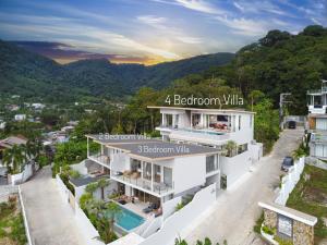 a bedroom villa with a view of the mountains at Capucine Villas in Kamala Beach
