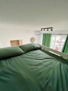 En eller flere senger på et rom på Green House Verona - Appartamento Comfort