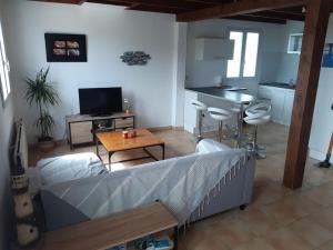 Postel nebo postele na pokoji v ubytování Maison entre Terre et Mer avec Jacuzzi + 4 fotografie