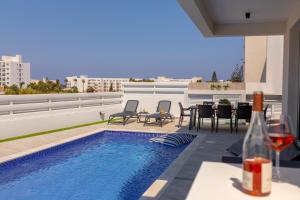 a swimming pool on the roof of a building at Protaras Sol e Mar Villa 3 in Protaras