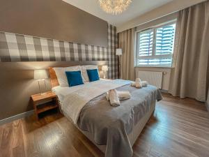 Posteľ alebo postele v izbe v ubytovaní ActivPark Apartments