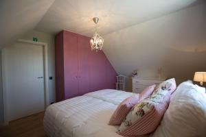 Postel nebo postele na pokoji v ubytování Cottage d'Hoge Schure