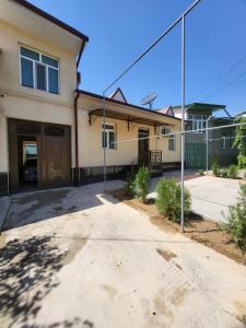 an empty driveway in front of a house at Shahriston GH in Tashkent