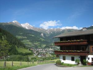 a view of a town in a valley with mountains at Gästeheim Pötscher in Matrei in Osttirol