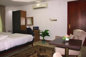 Postel nebo postele na pokoji v ubytování ريلاكس إن للشقق الفندقية Relax Inn Hotel Appartment