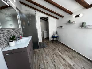 a bathroom with a sink and a shower at Gocce balsamiche in Ravarino