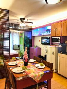 a kitchen with a table with chairs and a dining room at One Oasis A3 Shortwalk to Sm Mall - Free wifi in Davao City +30 photos