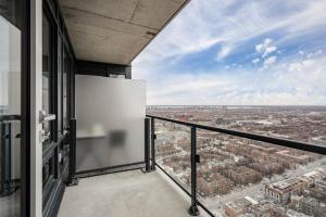 a balcony with a view of a city at Designer Estate - Downtown Montreal in Montreal