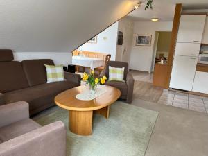 a living room with a couch and a table at Lieblingsort Buxtehude in Buxtehude